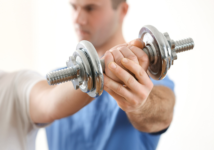 Physiotherapist Working with Elderly Patient in Clinic